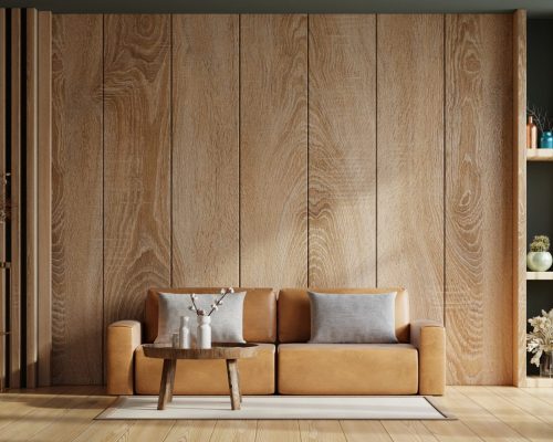 Interior living room wall mockup with leather sofa and decor on wooden wall background